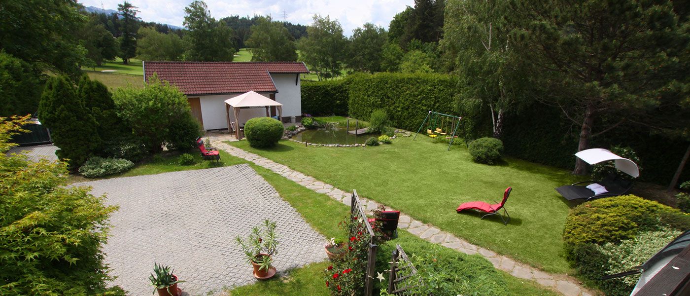 Garden with swimming pond from Appartements Wessely Lans